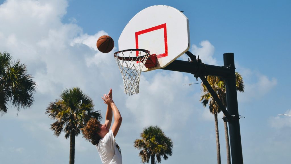 a person shooting a basketball
